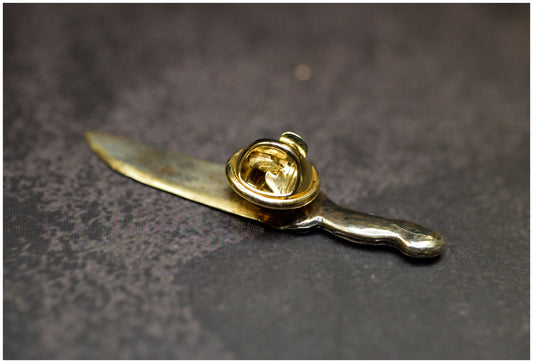 Pin cuchillo Eat the Rude bronce reverso