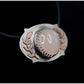 Rose quartz pendant with copper leaves