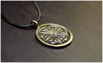 Colgante Roseta hexapétala Daisy bronce detalle